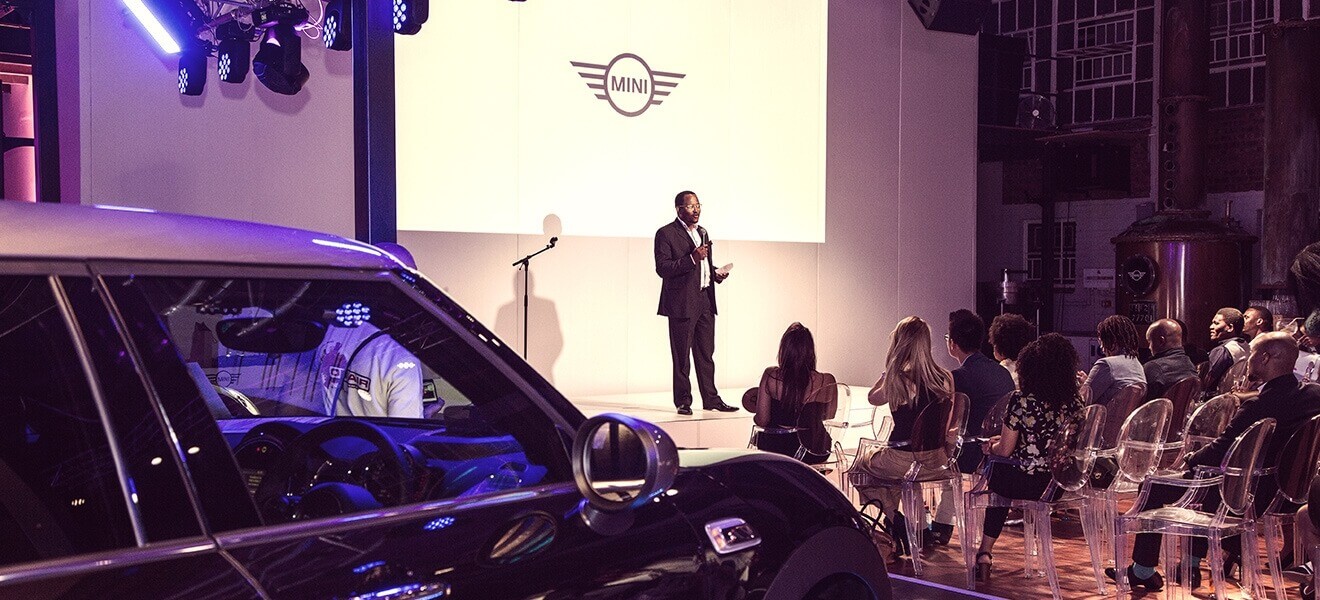 BMW South Africa Group Automotive Communications Manager Edward Makwana delivers the opening address at the MINI Auction.